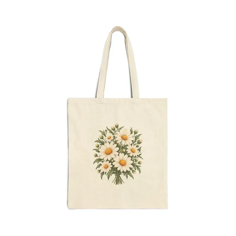 April daisy bouquet on a natural canvas tote — digital mockup